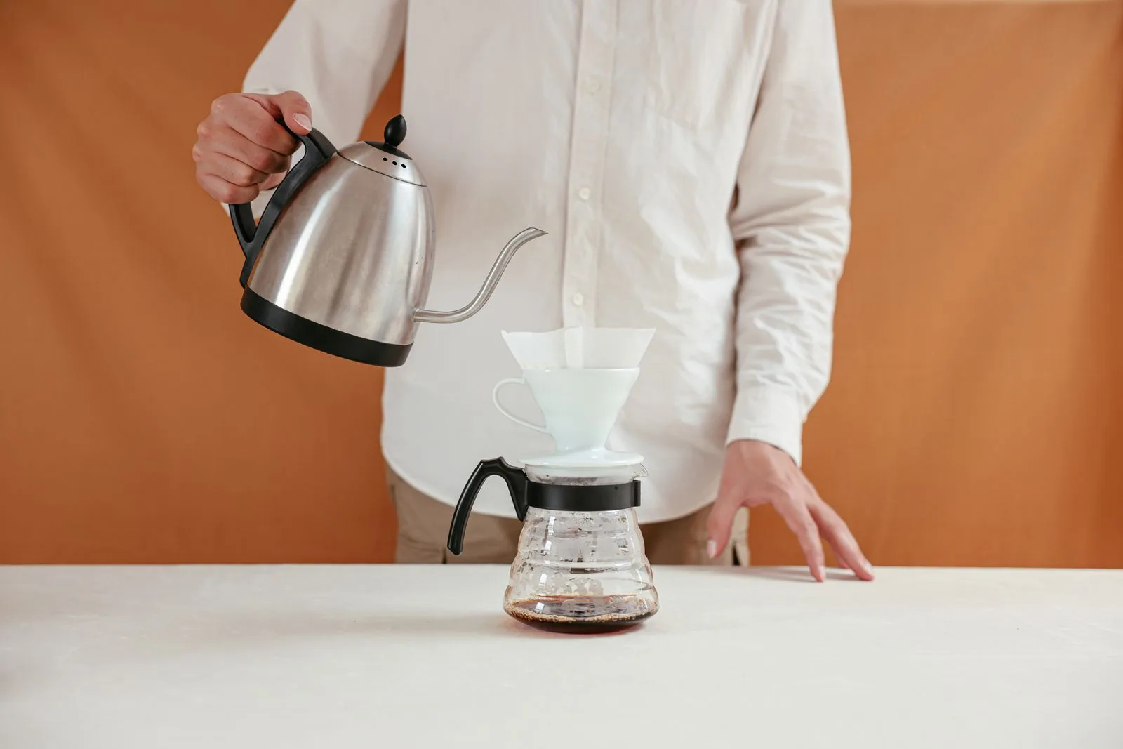 Hot water being poured for coffee brewing at controlled temperature