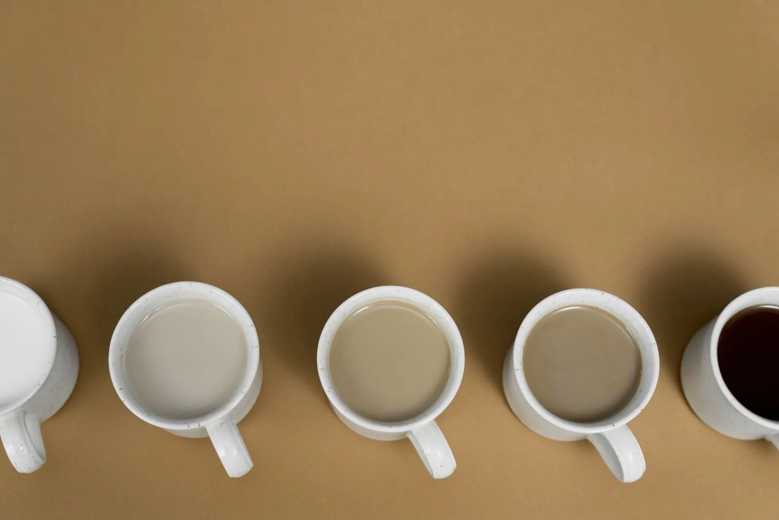 Collection of coffee cups and mugs in varying sizes showing different serving volumes