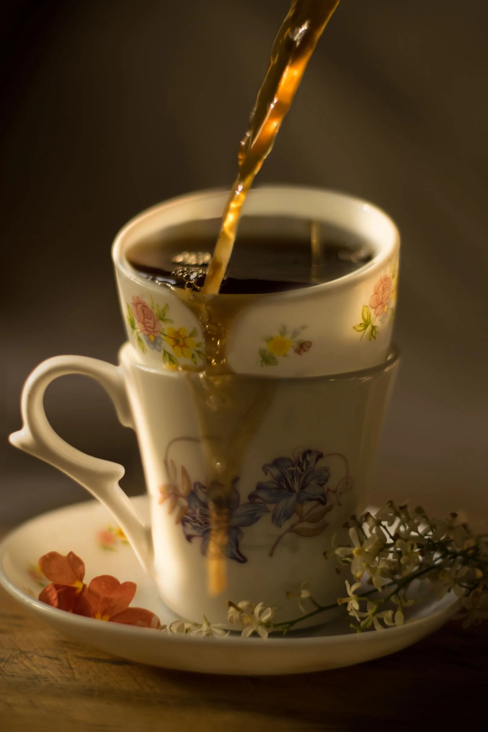 Decaffeinated coffee being poured into a ceramic cup