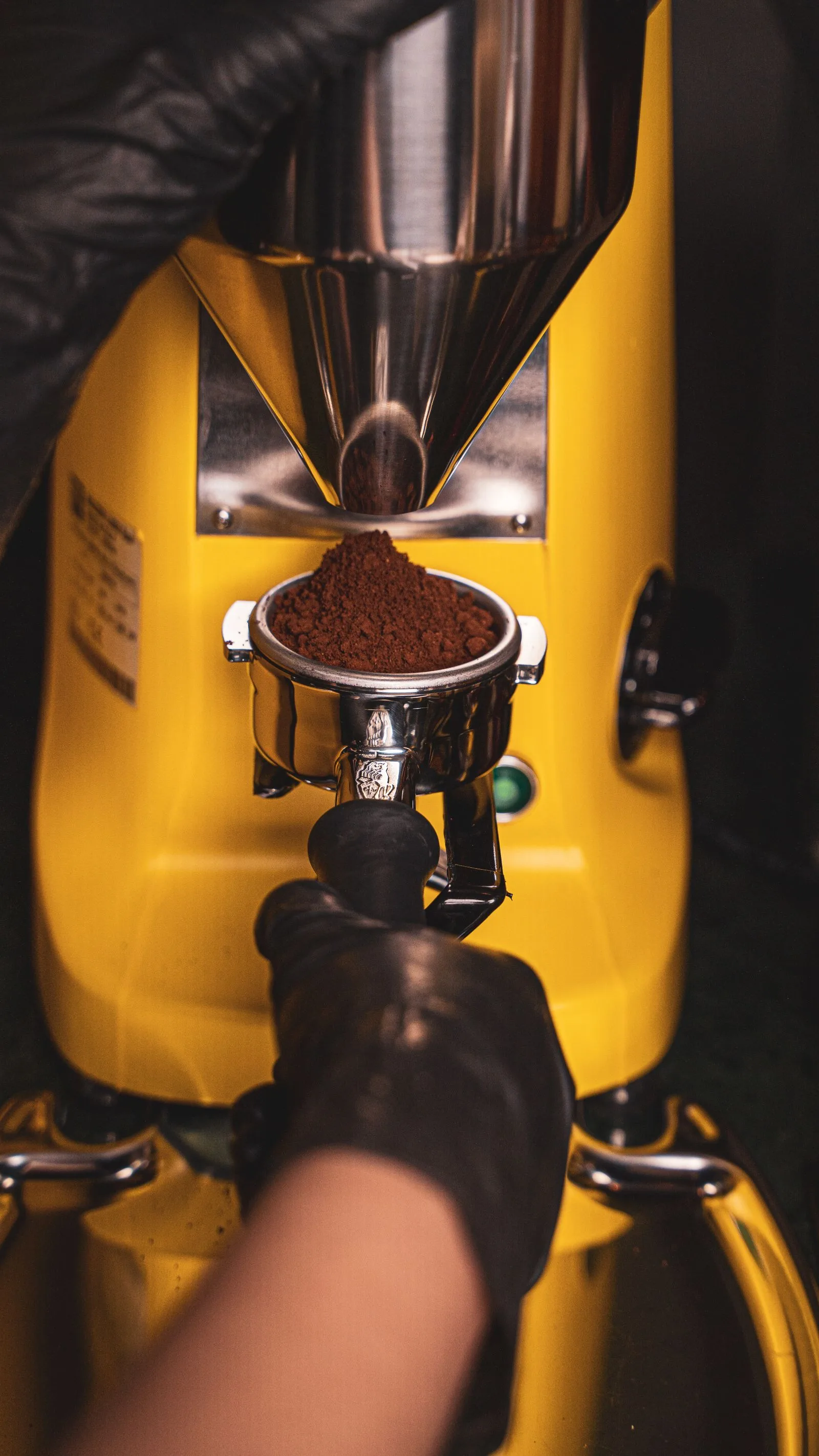 Extreme close-up of Turkish coffee grind with powdered sugar-like texture next to a scale